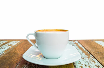 Hot coffee cup on old wooden table isolated on white background.
