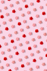 modern christmas background on pink backdrop. creative flat lay for christmas time, banners, posters, prints and other creative works.