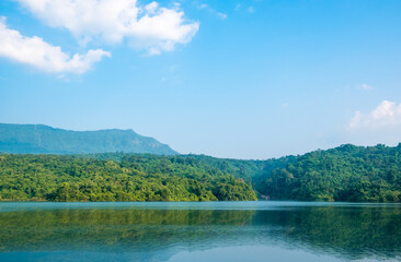 Cozy outdoor reservoir with terrace big mountain at sunset in the morning, Thailand. The atmosphere of the pool and the nature on the quiet hill. Dam with landscape background.