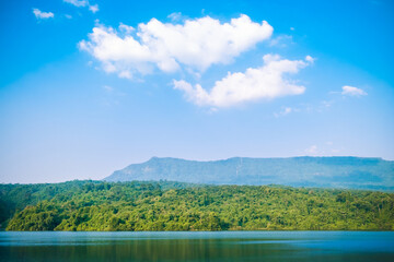 Cozy outdoor reservoir with terrace big mountain at sunset in the morning, Thailand. The atmosphere of the pool and the nature on the quiet hill. Dam with landscape background.