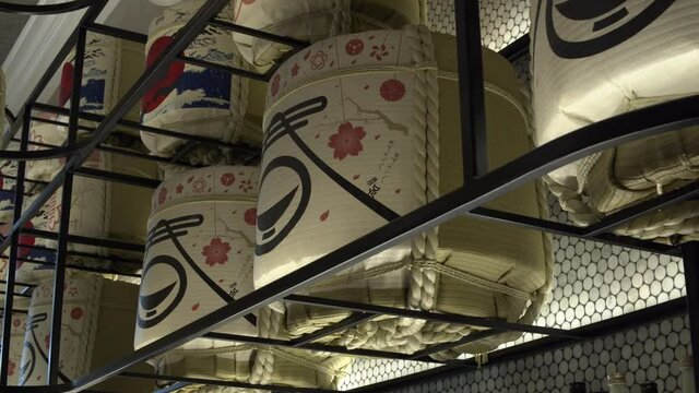 Moving shot of a collection of ceremonial Japanese drums.