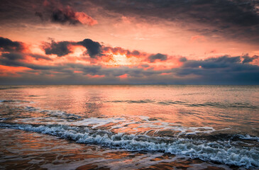 Beautiful golden sunset with blue sky over the horizon on the beach background, Thailand. Tropical twilight colorful sunrise from the landscape sea. Summer ocean vacation concept.