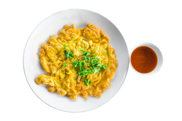 Above view of omelette with vegetable in ceramic plate isolated on white background. Omelet with onion it's egg fry popular traditional Thai Asian style food. Top view, Top-down
