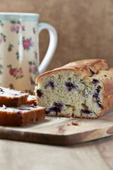 Simple Cake with Bilberries on wooden background. Close up. 