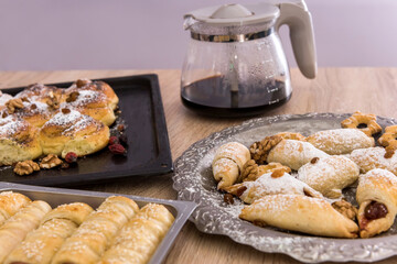  many tasty sausage in bread rolls and cup of coffee for breakfast