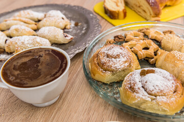 fresh tasty homemade buns with cup of coffee