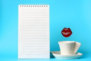 Delicious, mouth-watering, tempting caramel lips are isolated on a blue background over a coffee cup. The concept of lip augmentation. Beauty and cosmetology.