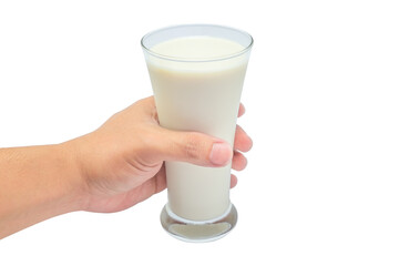 Glass of milk in hand isolated on white background.