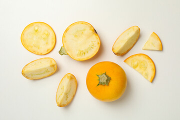 Round zucchini and slices on white background, top view