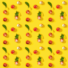 Seamless regular creative pattern from ripe small red apples, food background.
