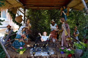 Statuettes of Mary, Joseph and baby Jesus,The birthday of Jesus is a statuette of Maria with Joseph and newborn Jesus on the hay, A Christmas nativity scene.