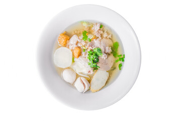 Noodles of Thai style clear soup in traditional ceramic bowl isolated on white background. view from above