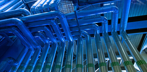 Fototapeta premium Industrial zone, Steel pipelines in green tones