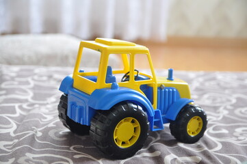 Children's toy tractor in the children's room.