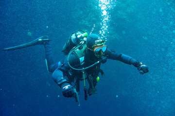Scuba diver in the middle of bubbles