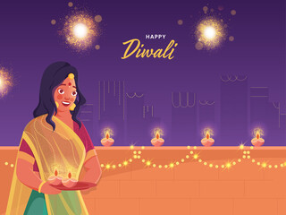 Beautiful Young Woman Holding Plate of Lit Oil Lamps (Diya) on Decorative Balcony for Happy Diwali Celebration.