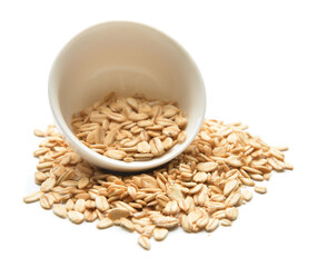 Bowl with raw oatmeal on white background