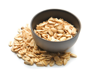 Bowl with raw oatmeal on white background
