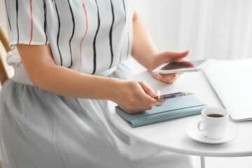 Fototapeta premium Online shopping and digital payment security, woman using credit card and smartphone for e-commerce