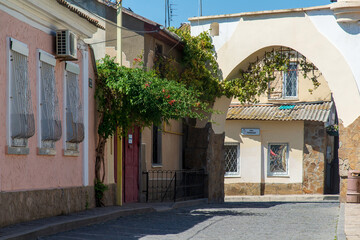 Fototapeta na wymiar Fragment of the street of the old city at a sunny afternoon, Evpatoria, Crimea.