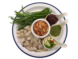 Fresh spicy oyster with spicy dipping sauce on white dish isolate on white background.Thai seafood style.