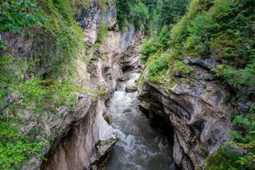 Fototapeta na wymiar Rough river Belaya (White) in Khadzhokhsky gorge, summer. Russia , the Republic of Adygea .