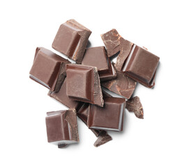 Pieces of delicious dark chocolate isolated on white, top view