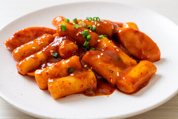Korean rice cake stick with sausage in spicy sauce - Tteokbokki