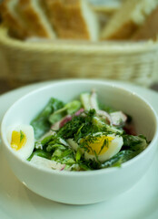 Fresh mixed salad with eggs, lettuce and other vegetables.