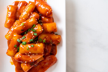 Korean rice cake stick with sausage in spicy sauce - Tteokbokki