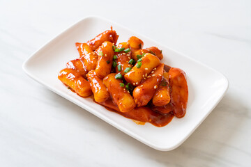 Korean rice cake stick with sausage in spicy sauce - Tteokbokki