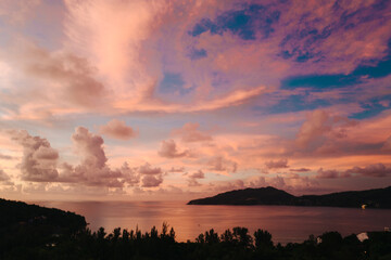 Natural sunset with colorful clouds, gold and blue sky.