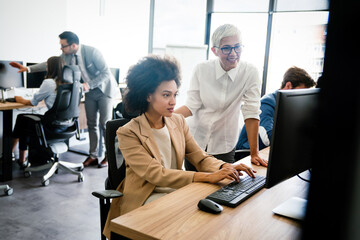 Creative people working in office on computer