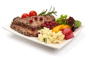 Sliced Baked pork meat with rice and vegetables, isolated on white background