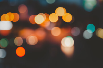 City street and traffic lights blurred abstract background at night.