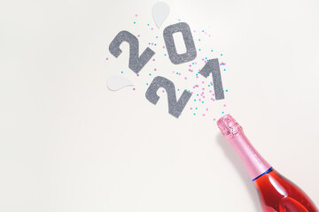 Christmas composition with bottle of champagne on white background