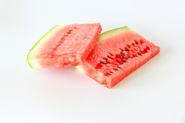 Red ripe watermelon sliced on a white background.