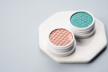 makeup brushes eyeshadow collection professional cosmetics on gray background