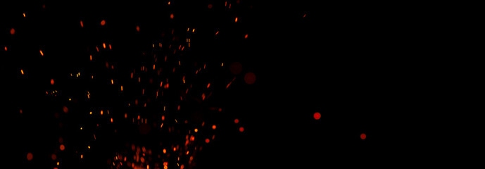 Flying smeared sparks on a black background. Banner with copy space for text.