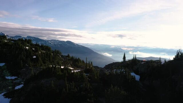 Aerial Fly Over Mountains During Sunrise