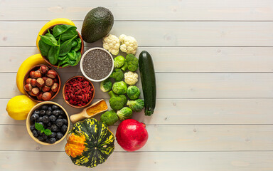 Fresh raw italian filled pasta ravioli or tortelli with mushrooms, pesto, and ricotta.