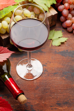 Red wine and grapes