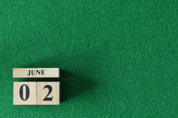 June 2, number cube on snooker table, sport background.