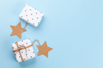 Christmas gift boxes over blue background