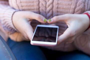 Closeup of a woman using a mobile phone