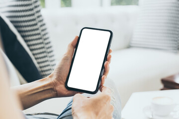 cell phone mockup blank white screen.woman hand holding texting using mobile on desk at coffee shop.background empty space for advertise.work people contact marketing business,technology