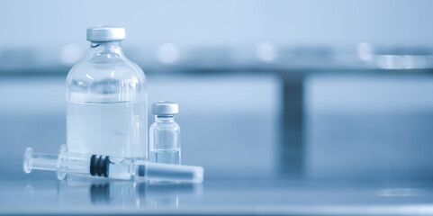 Vaccine coronavirus deverlopment vial dose flu shot drug needle syringe,medical concept vaccination hypodermic injection treatment disease care hospital prevention immunization illness disease.