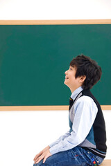 boy in front of blackboard