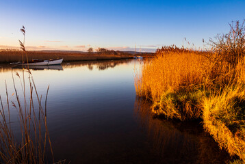 Bright sunny winter morning along the river frome near Wareham in Dorset south west England