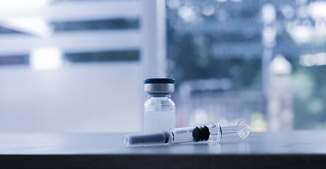 Vaccine coronavirus deverlopment vial dose flu shot drug needle syringe,medical concept vaccination hypodermic injection treatment disease care hospital prevention immunization illness disease.